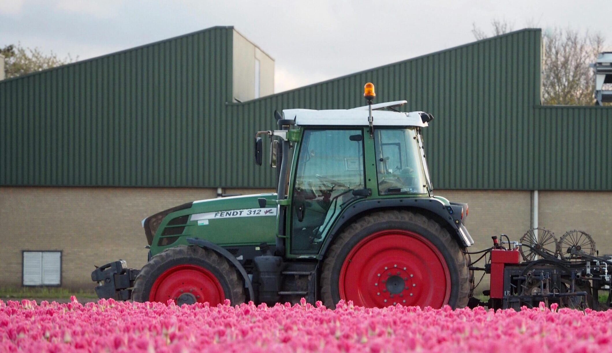 APR and BPR changes. Tractor on farm in pink field.